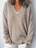 Apricotfarbener Pullover mit V-Ausschnitt und langen Ärmeln